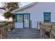Exterior view of the home's entrance, showcasing a wooden deck and a 'WELCOME' sign at 4254 N 200 W, Greenfield, IN 46140