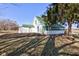 Charming two-story home featuring a green roof and well-maintained landscaping, surrounded by lush trees at 4254 N 200 W, Greenfield, IN 46140