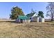 Exterior showing outbuildings with a green metal roof on a property with expansive farmland at 4254 N 200 W, Greenfield, IN 46140