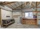Functional garage interior with a workbench, lighting, and plenty of room for storage and projects at 4254 N 200 W, Greenfield, IN 46140