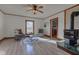 Cozy living room with a vintage wood stove, ceiling fan, and neutral decor at 4254 N 200 W, Greenfield, IN 46140