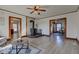 Spacious living room features a vintage wood stove, ceiling fan, and hardwood floors at 4254 N 200 W, Greenfield, IN 46140