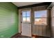 Sunroom entrance featuring a bright window, weathered wood, and ample natural light at 4254 N 200 W, Greenfield, IN 46140