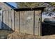 Exterior view of wood shed with weathered walls and a small sign on the side at 4254 N 200 W, Greenfield, IN 46140