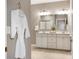 Bathroom featuring a double vanity, ample storage, and modern fixtures at 4313 W Hidden Preserve Cv, New Palestine, IN 46163