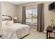 Comfortable bedroom featuring a queen bed, neutral decor, and a large window with natural light at 4313 W Hidden Preserve Cv, New Palestine, IN 46163