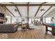 Large community room with seating, a pool table, fireplace, and kitchen area at 4313 W Hidden Preserve Cv, New Palestine, IN 46163