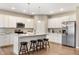 Stylish kitchen features white cabinets, a kitchen island, granite countertops, and stainless steel appliances at 4313 W Hidden Preserve Cv, New Palestine, IN 46163