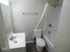 Bright bathroom featuring a sink, toilet, bathtub with shower, and modern fixtures at 4530 Wichser Ct, Indianapolis, IN 46228