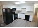 Modern kitchen featuring stainless steel appliances, granite countertops, and ample cabinet space at 4530 Wichser Ct, Indianapolis, IN 46228