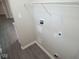 Laundry room area with washer/dryer hookups and white storage shelves at 4530 Wichser Ct, Indianapolis, IN 46228