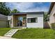Charming single-Gathering home with a modern design, large windows, and vibrant green lawn at 632 N Temple Ave, Indianapolis, IN 46201
