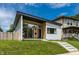 Beautifully renovated single-Gathering home featuring modern design, lush green lawn, and ample natural light at 632 N Temple Ave, Indianapolis, IN 46201