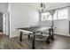 Spacious game room with a ping pong table, modern lighting, and large windows at 632 N Temple Ave, Indianapolis, IN 46201