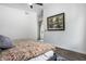 Bright main bedroom features artwork, a ceiling fan, and modern finishes at 632 N Temple Ave, Indianapolis, IN 46201