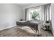 Bright room with natural light, featuring clean walls, light wood flooring, and serene view from the large window at 632 N Temple Ave, Indianapolis, IN 46201