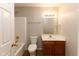 Cozy bathroom featuring a shower and tub, vanity, and good lighting at 6513 Kingsbury Way, Zionsville, IN 46077
