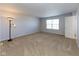 Spacious bedroom with plush carpeting, neutral walls, and a large window offering plenty of natural light at 6513 Kingsbury Way, Zionsville, IN 46077