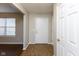 Inviting entryway with neutral paint, wood-look floors, and a bright front door at 6513 Kingsbury Way, Zionsville, IN 46077