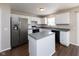 Modern kitchen features stainless steel appliances, white cabinets, and a functional island at 6513 Kingsbury Way, Zionsville, IN 46077