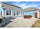 Beautiful backyard patio with a hot tub, outdoor seating, and well-maintained landscaping for relaxation and enjoyment at 725 E County Rd 600 N, Pittsboro, IN 46167