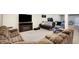 Spacious basement features plush carpeting, a large TV, and plenty of seating for relaxing and entertaining at 725 E County Rd 600 N, Pittsboro, IN 46167