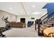 Finished basement area with exercise equipment, stairs, and flexible recreational space at 725 E County Rd 600 N, Pittsboro, IN 46167