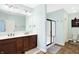 Well-lit bathroom featuring a double sink vanity, walk-in shower, and a neutral color palette at 725 E County Rd 600 N, Pittsboro, IN 46167