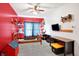 Cozy bedroom featuring a red accent wall, ample shelving, and a comfortable place to unwind at 725 E County Rd 600 N, Pittsboro, IN 46167