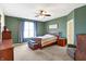 Spacious bedroom featuring a ceiling fan, wooden furniture, and an inviting atmosphere at 725 E County Rd 600 N, Pittsboro, IN 46167