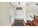 Bright foyer featuring a coat rack with bench and beautiful hardwood flooring at 725 E County Rd 600 N, Pittsboro, IN 46167