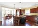 Well-equipped kitchen with modern appliances and island, open to a dining area with lots of natural light at 725 E County Rd 600 N, Pittsboro, IN 46167