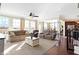 Spacious living room with lots of natural light, hardwood floors, and comfortable seating at 725 E County Rd 600 N, Pittsboro, IN 46167