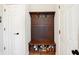 Functional mudroom area with a wooden storage bench and coat rack, perfect for organization at 725 E County Rd 600 N, Pittsboro, IN 46167