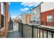 Community view from the balcony, showcasing modern townhouse exteriors with gray and brick facades at 805 Switchyard Pl, Indianapolis, IN 46202