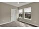 Bedroom featuring plush carpet and windows overlooking a green landscape at 805 Switchyard Pl, Indianapolis, IN 46202