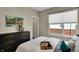 Bright bedroom featuring large window, an abstract painting, and inviting decor at 805 Switchyard Pl, Indianapolis, IN 46202