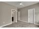 Bedroom featuring neutral walls, plush carpet, and two doors with one leading to the bathroom at 805 Switchyard Pl, Indianapolis, IN 46202
