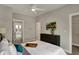 Neutral bedroom with a ceiling fan, grey walls, and an abstract art piece above a dark wood dresser at 805 Switchyard Pl, Indianapolis, IN 46202