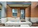 The front entryway features a concrete porch, updated fixtures, and modern design elements for added curb appeal at 805 Switchyard Pl, Indianapolis, IN 46202