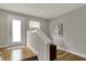 Cozy and bright entryway featuring hardwood floors, fresh paint, and stylish decor setting a welcoming tone at 805 Switchyard Pl, Indianapolis, IN 46202