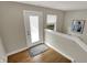 Bright entryway with hardwood floors, modern light fixtures, leading to main level at 805 Switchyard Pl, Indianapolis, IN 46202