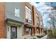 Modern townhomes showcase a harmonious blend of brick and siding, offering contemporary curb appeal at 805 Switchyard Pl, Indianapolis, IN 46202