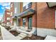 This townhome row offers a harmonious streetscape with varied facades, each unit featuring its own private entrance at 805 Switchyard Pl, Indianapolis, IN 46202