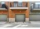 Exterior shows a brick townhome with garage and private balcony, offering modern living at 805 Switchyard Pl, Indianapolis, IN 46202