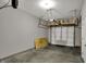 Spacious garage offers parking and storage, with ceiling mounted rack for organization at 805 Switchyard Pl, Indianapolis, IN 46202