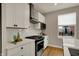 Modern kitchen with stainless steel appliances, white subway tile backsplash, and white cabinets at 805 Switchyard Pl, Indianapolis, IN 46202