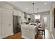 Contemporary kitchen with stainless steel appliances, white cabinets, and a functional center island at 805 Switchyard Pl, Indianapolis, IN 46202