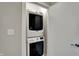 Convenient laundry room with a stacked washer and dryer unit for efficient space saving at 805 Switchyard Pl, Indianapolis, IN 46202