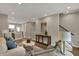 Spacious living room with a view of the kitchen, neutral color palette, and ample natural light at 805 Switchyard Pl, Indianapolis, IN 46202